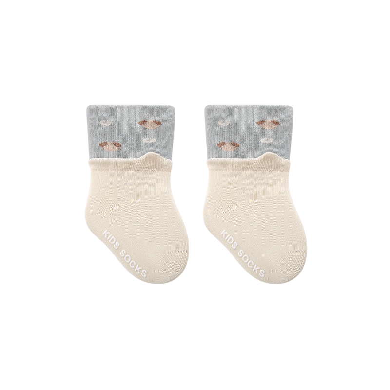 Pair of baby socks with gray tops and beige cuffs on a white background