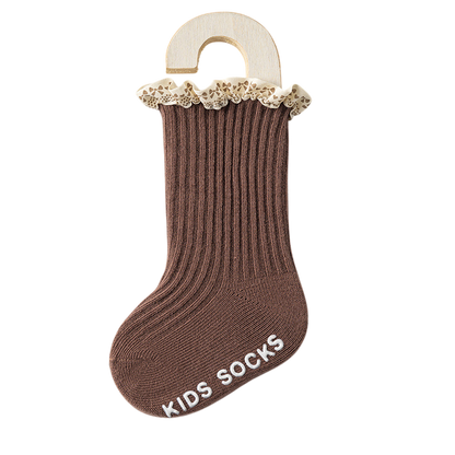 Brown kids sock with lace trim on a white background