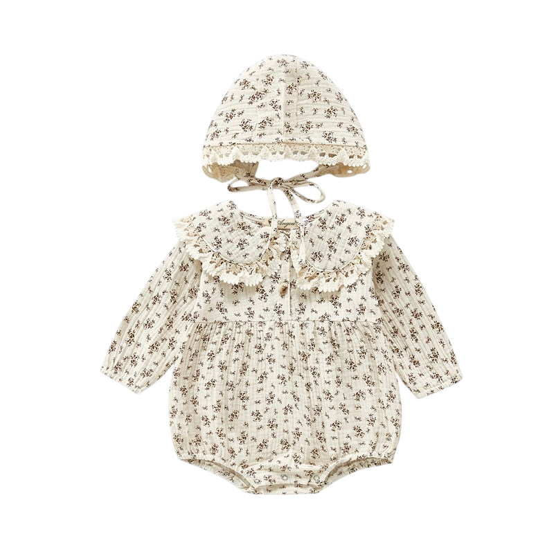 Baby romper with floral pattern and matching hat on a white background