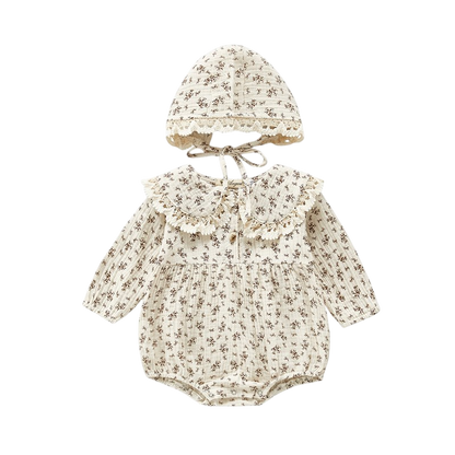 Baby romper with floral pattern and matching hat on a white background