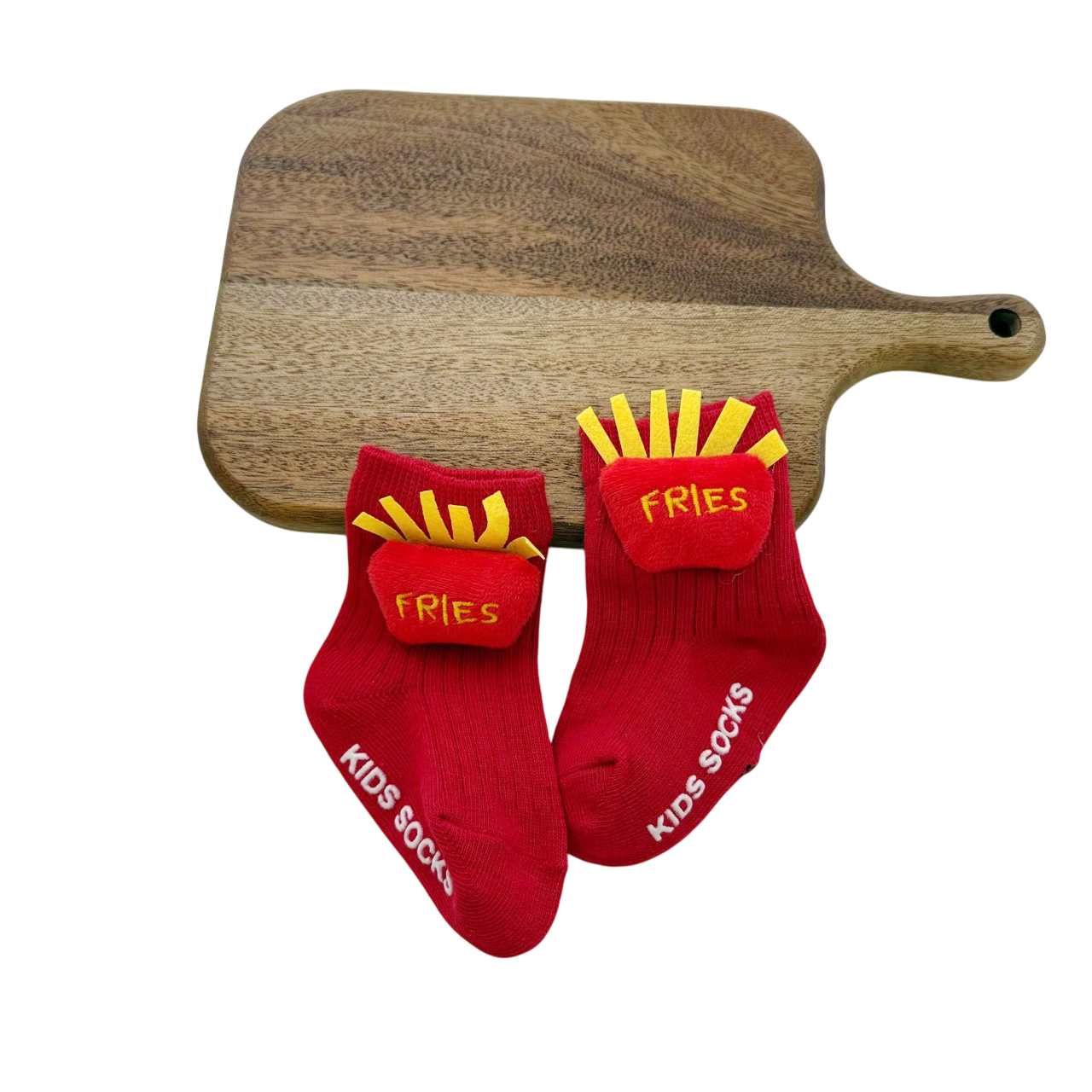 Red socks with 'Fries' design and 'Kids Socks' text on a wooden cutting board.