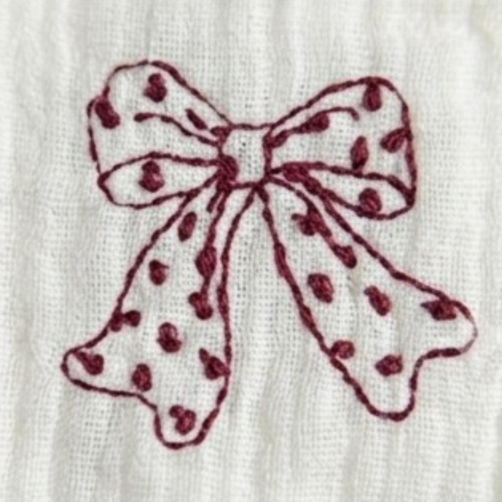Red and White Bow Baby Bib styled product image, view 3