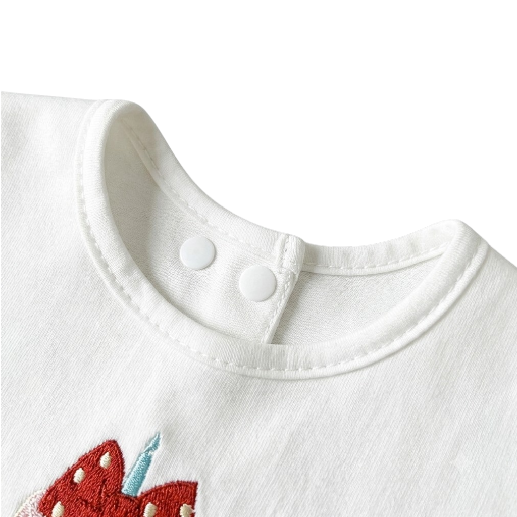 Bow Birthday Cake Baby Bib styled product image, view 3