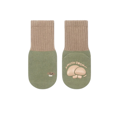 Pair of green socks with mushroom design on a white background