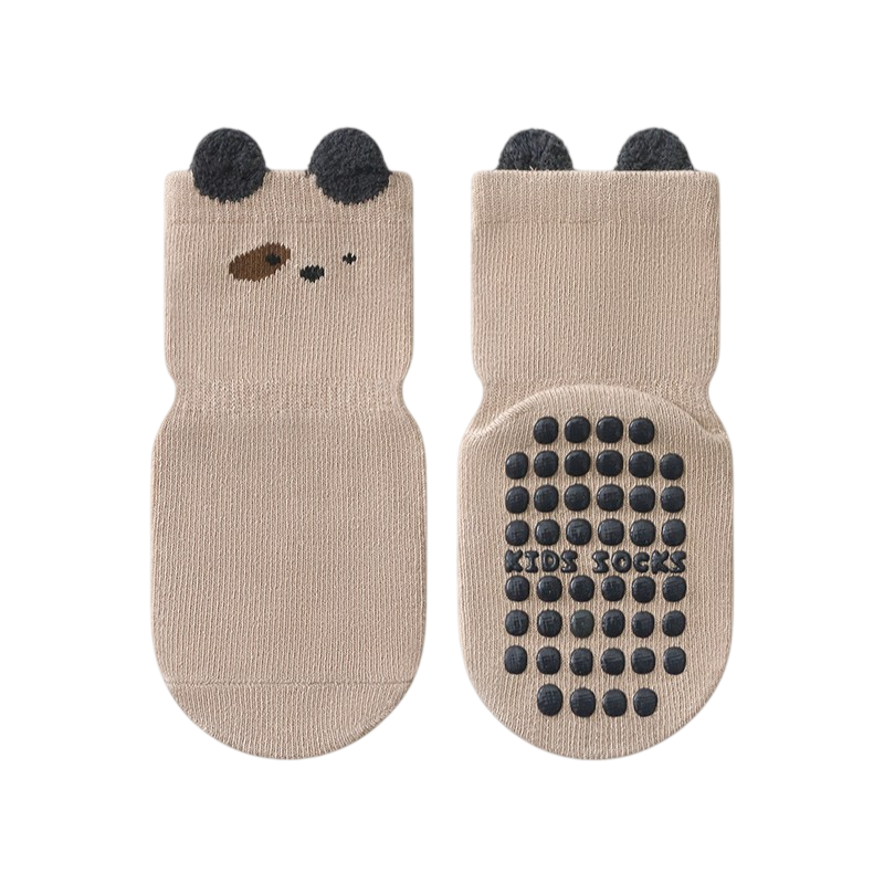 Pair of beige socks with bear face design and black dots on a white background