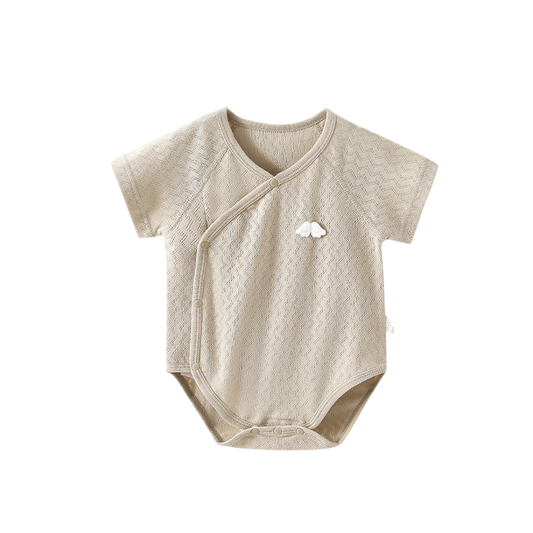 Beige baby bodysuit with a small logo on a white background
