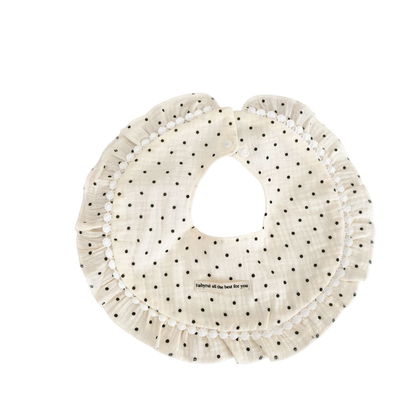 Polka dot bib with text on a white background