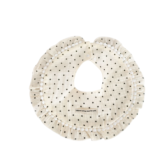 Polka dot bib with text on a white background