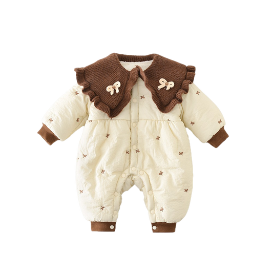 Baby romper with brown collar and trim on a white background