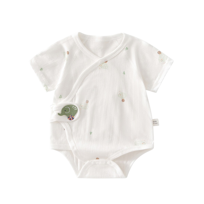 White baby bodysuit with green elephant design on a white background