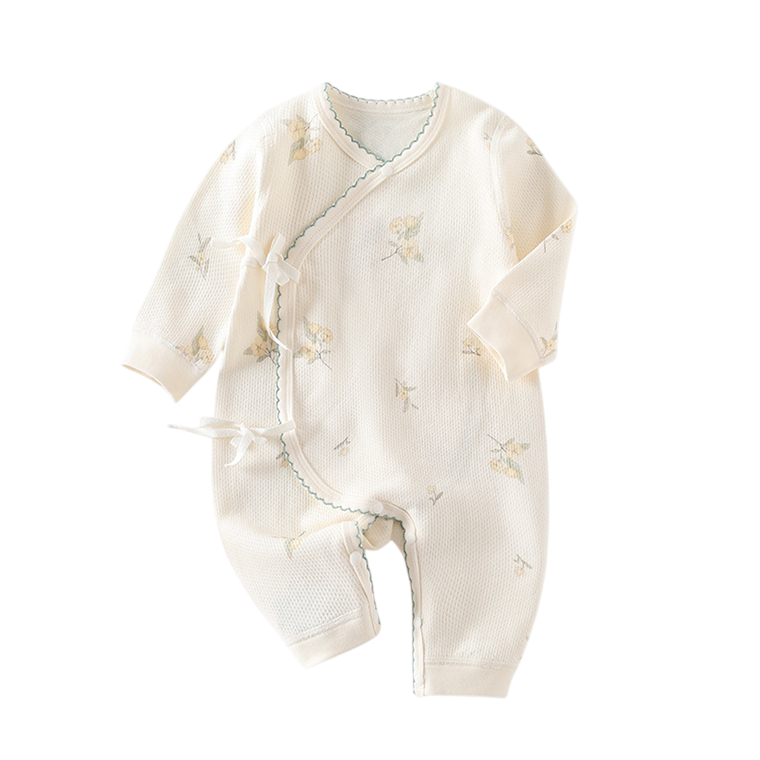 Baby romper with floral patterns on a white background