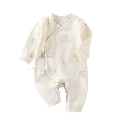 Baby romper with floral patterns on a white background