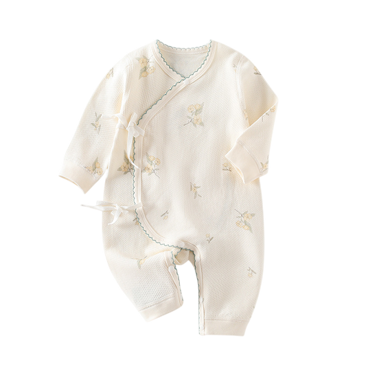 Baby romper with floral patterns on a white background
