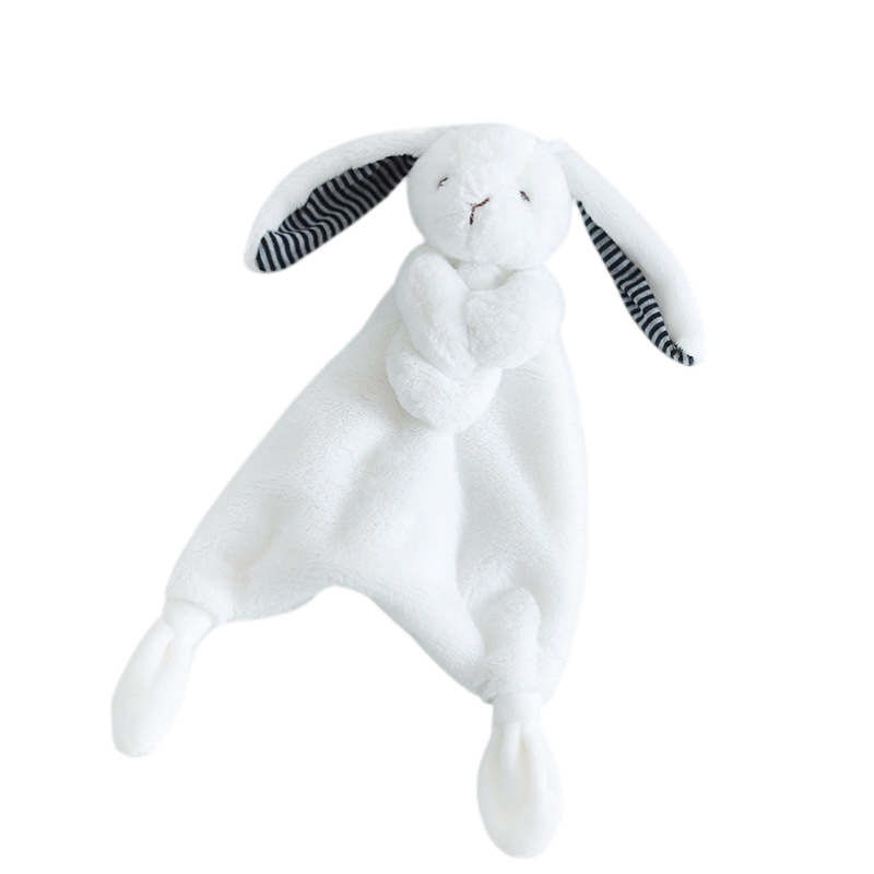 White plush bunny toy with black striped ears on a white background