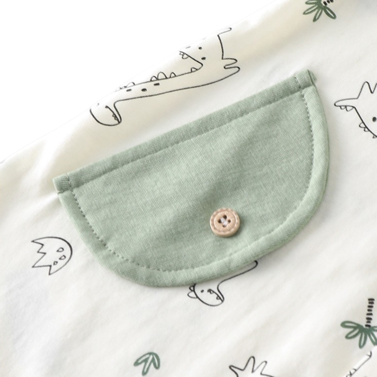 Sage Green Dinosaur Baby Romper on a white background, view 4