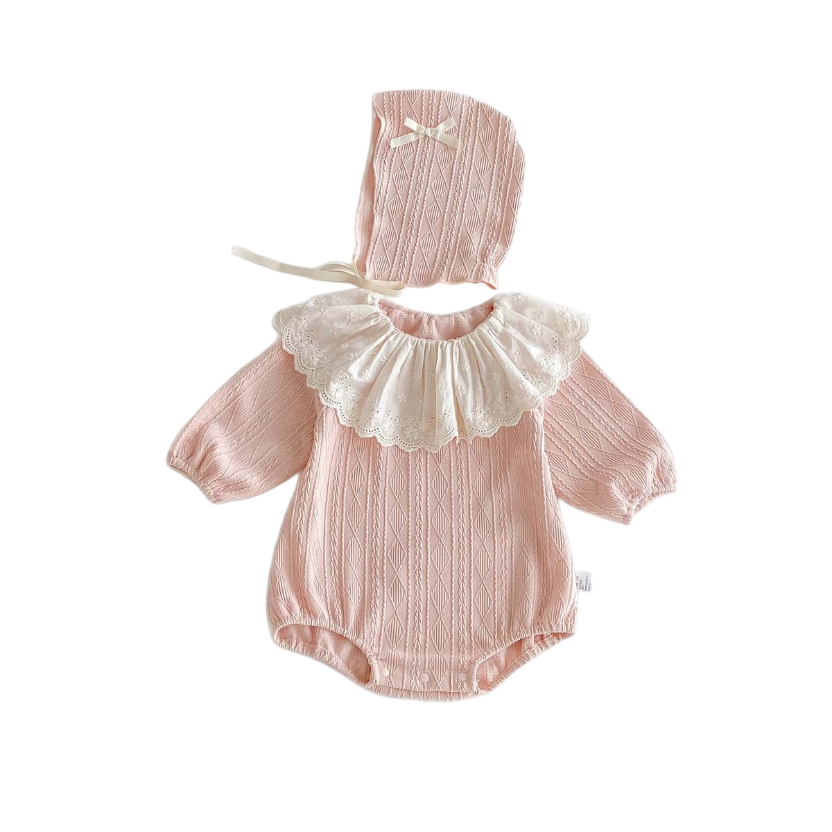 Pink baby romper with lace collar and matching bonnet on a white background
