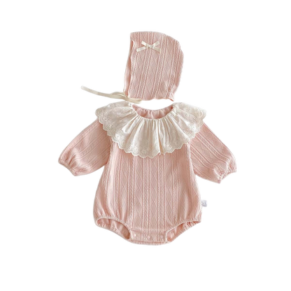 Pink baby romper with lace collar and matching bonnet on a white background