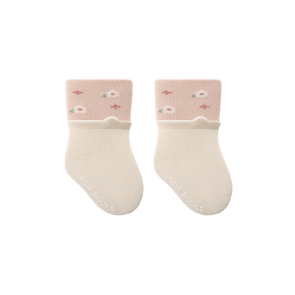 Pair of baby socks with pink tops and white cuffs on a white background