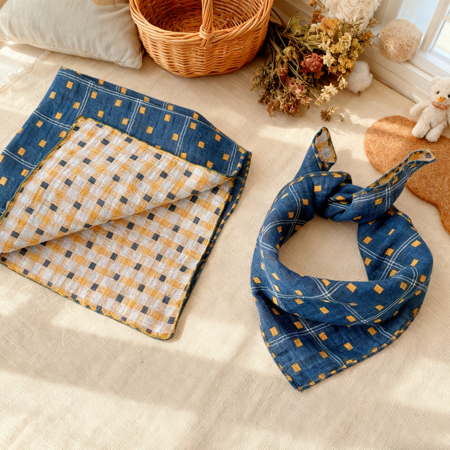 Folded fabric with blue and yellow checkered pattern on a light surface.
